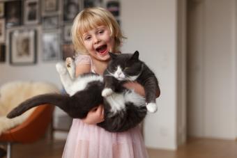 Happy girl with cat 