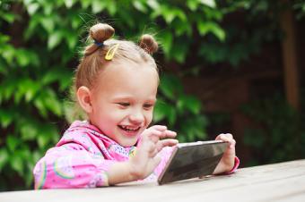 Toddler girl using a smart phone