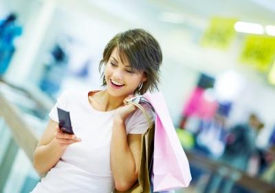 Woman reading text messages on her cell phone