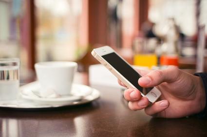 Using an iPhone at a cafe