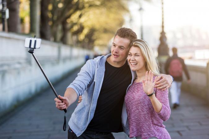 Couple taking a selfie with selfie stick