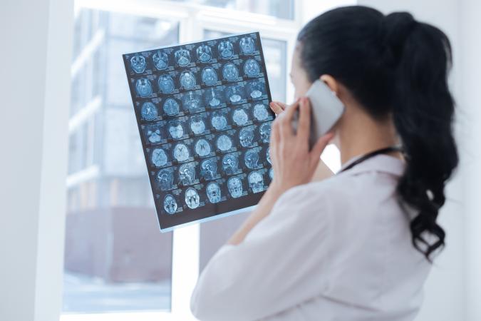 oncologist viewing x ray