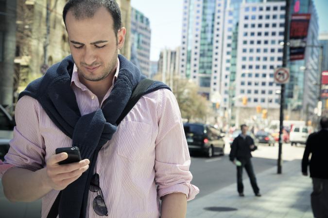 man on cell phone downtown Toronto