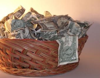 Wicker basket filled with dollar bills