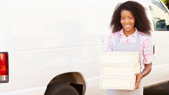 Baker Unloading Pie Boxes From Van