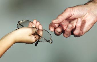 Child donating eyeglasses