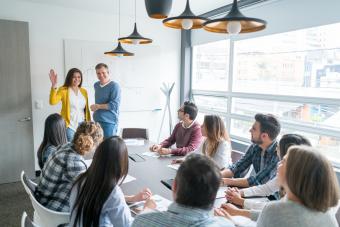 Group of people in a business meeting at the office introducing a new member of the team