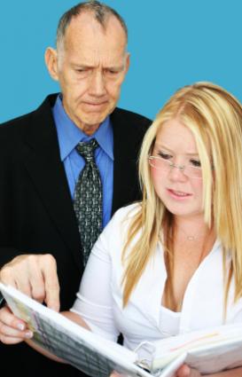 Man and woman inspecting documents