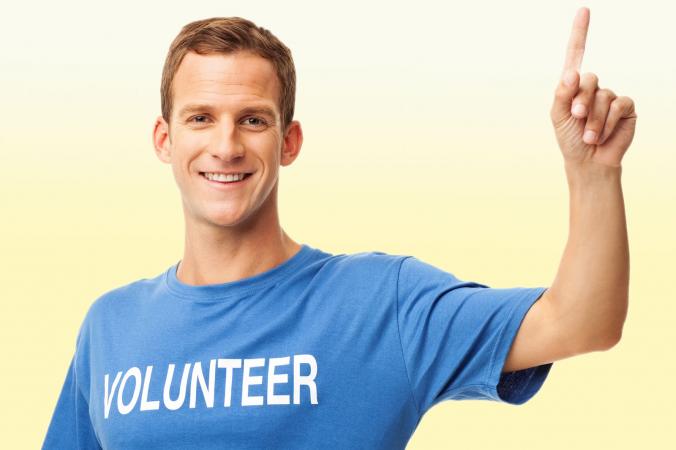 Man raising hand to volunteer