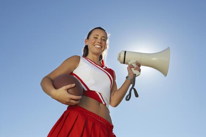 Cheerleader using a megaphone