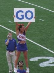 Corey Stone films his cheerleaders as they perform a stunt.