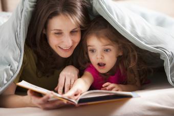 mother and daughter reading book