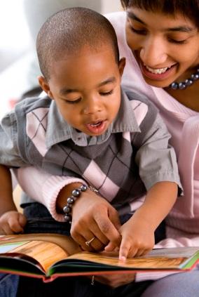 boy reading with mother