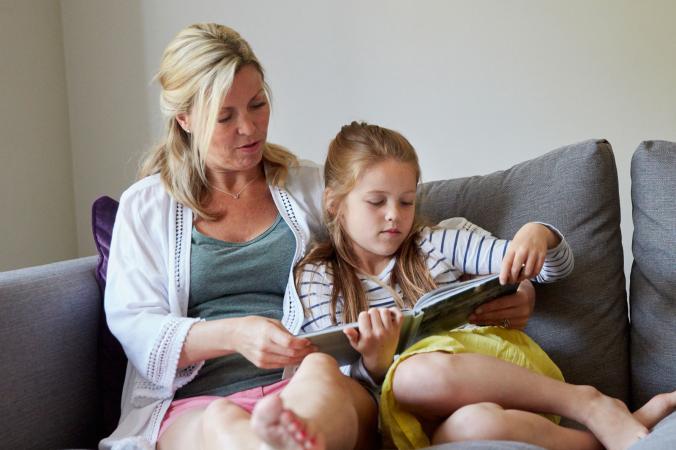 Mother and daughter reading a storybook