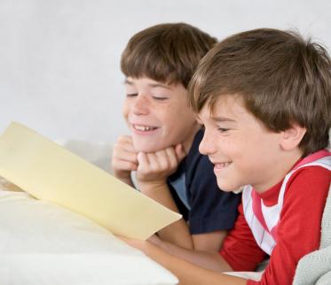 boys reading a book