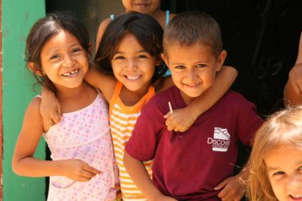 Three smiling kids.