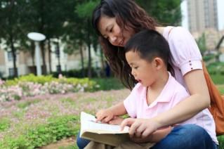 mother and son reading in spring
