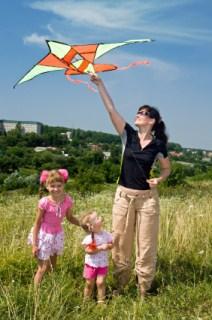 mom with girls and kite