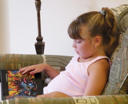 Girl reading a book.