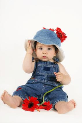 Little girl in denim with hat and flower