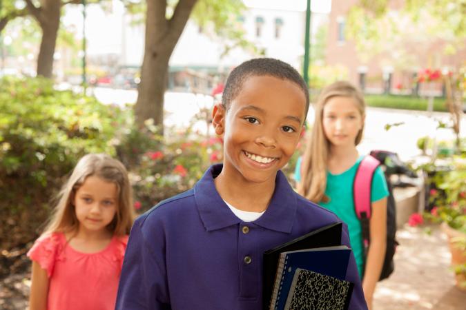 School Boy in Deep Purple Polo Shirt