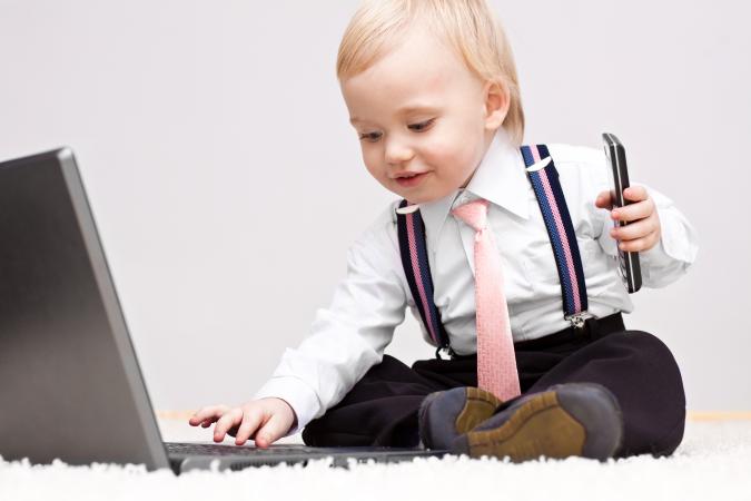 business baby with cellphone and laptop