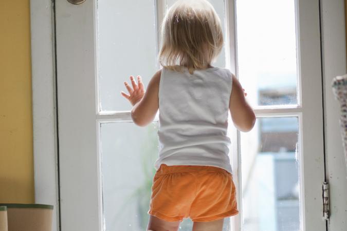 Toddler in orange shorts