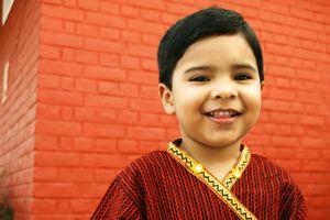 Indian boy in red and gold kurta
