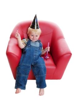 toddler boy in red chair