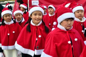 South Korean children wearing Santa Claus outfits in Seoul