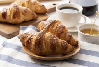 french croissants with honey and coffee