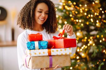 smiling woman with gifts on Christmas