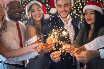 Friends at Christmas with sparkling bengal lights