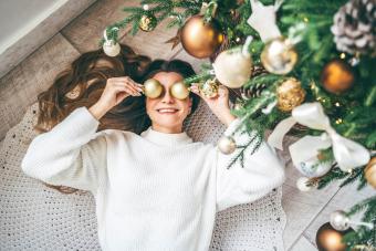 Woman having fun with Christmas balls