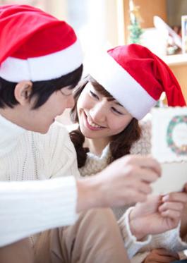 Couple reading romantic poetry in card together