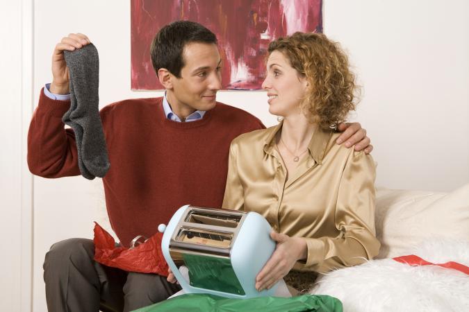 Couple holding gifts