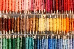 string organized by color in a craft room