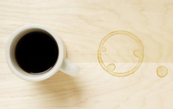 Cup of coffee and coffee ring on table