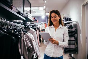 Woman checking inventory in a clothing store