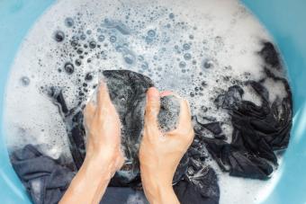 Woman washing clothes by hand