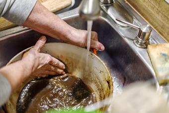 Scrubbing Burnt Food Residue Out of Dutch Oven Cooking Pan