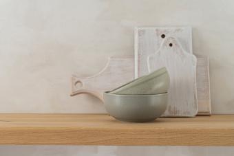 White wood cutting boards and ceramic bowls