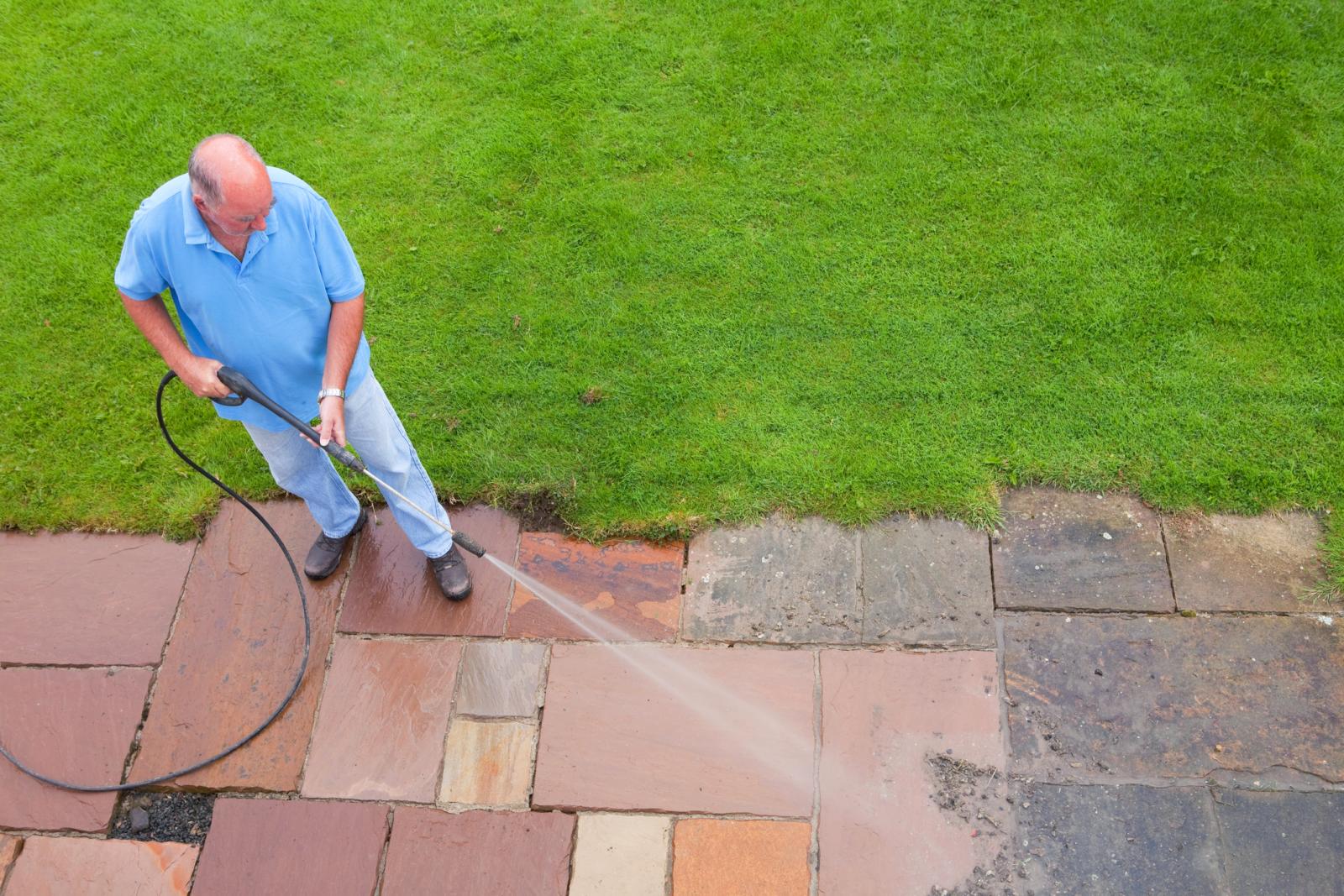 Man Washing Patio Slabs