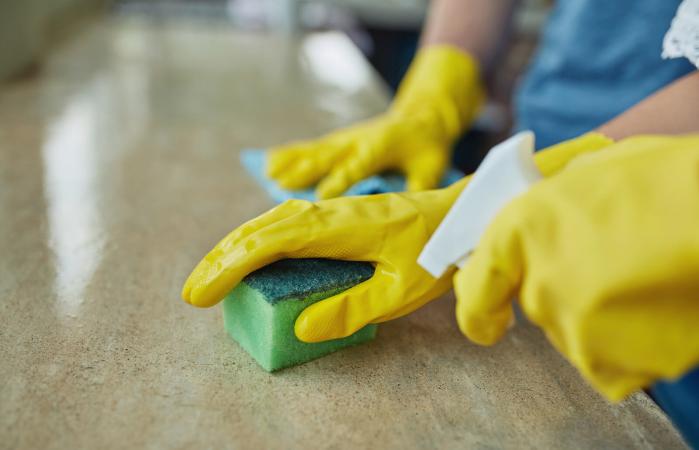 couple cleaning a surface at home