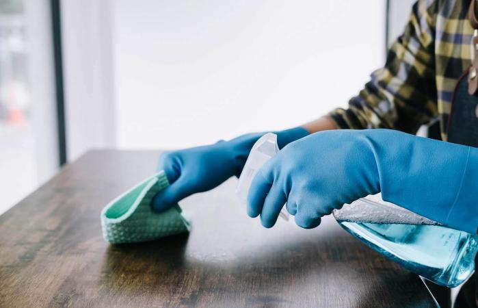 Person Using Disinfectant