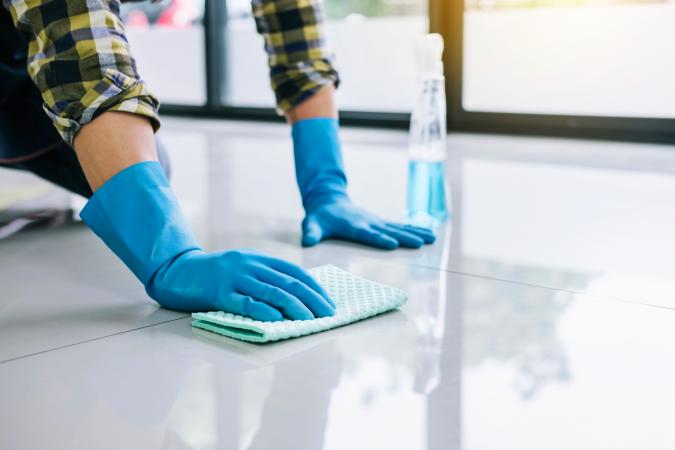 Man Cleaning Tiled Floor