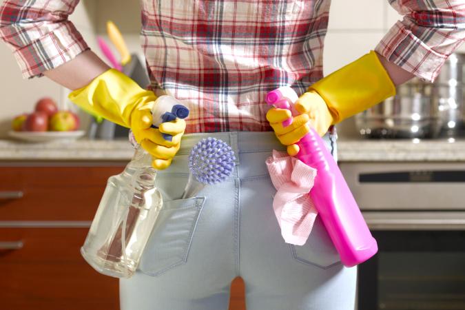 Girl preparing to clean kitchen