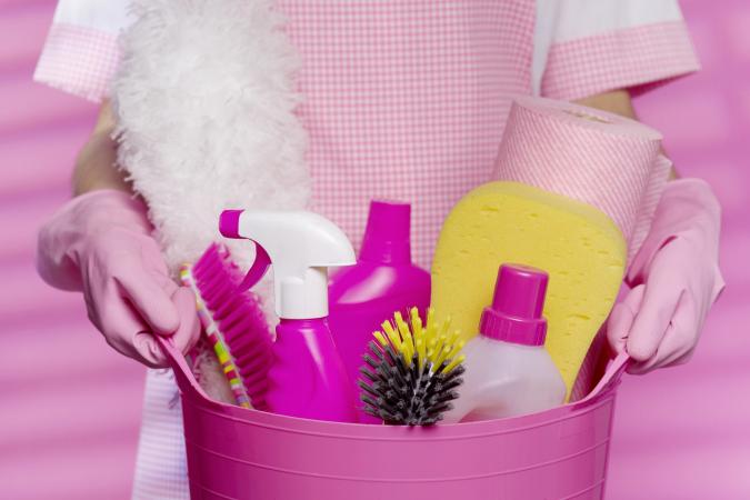 Woman with cleaning supplies