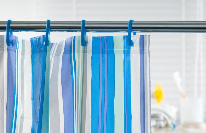 Blue shower curtain in the bathroom