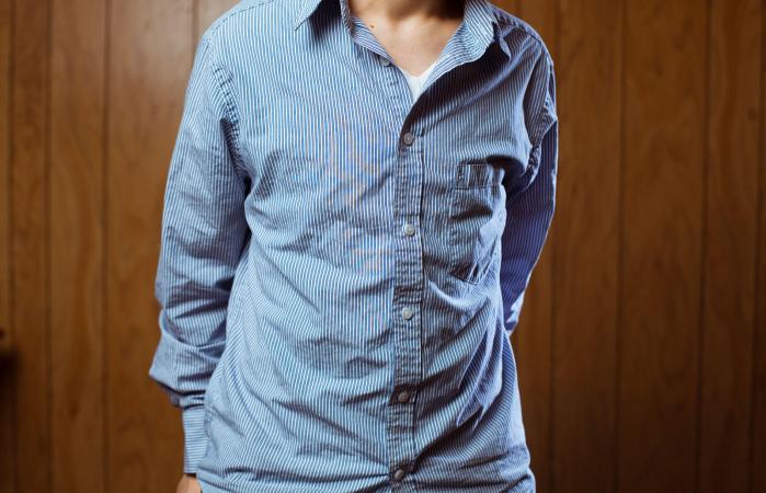 slightly wrinkled blue shirt